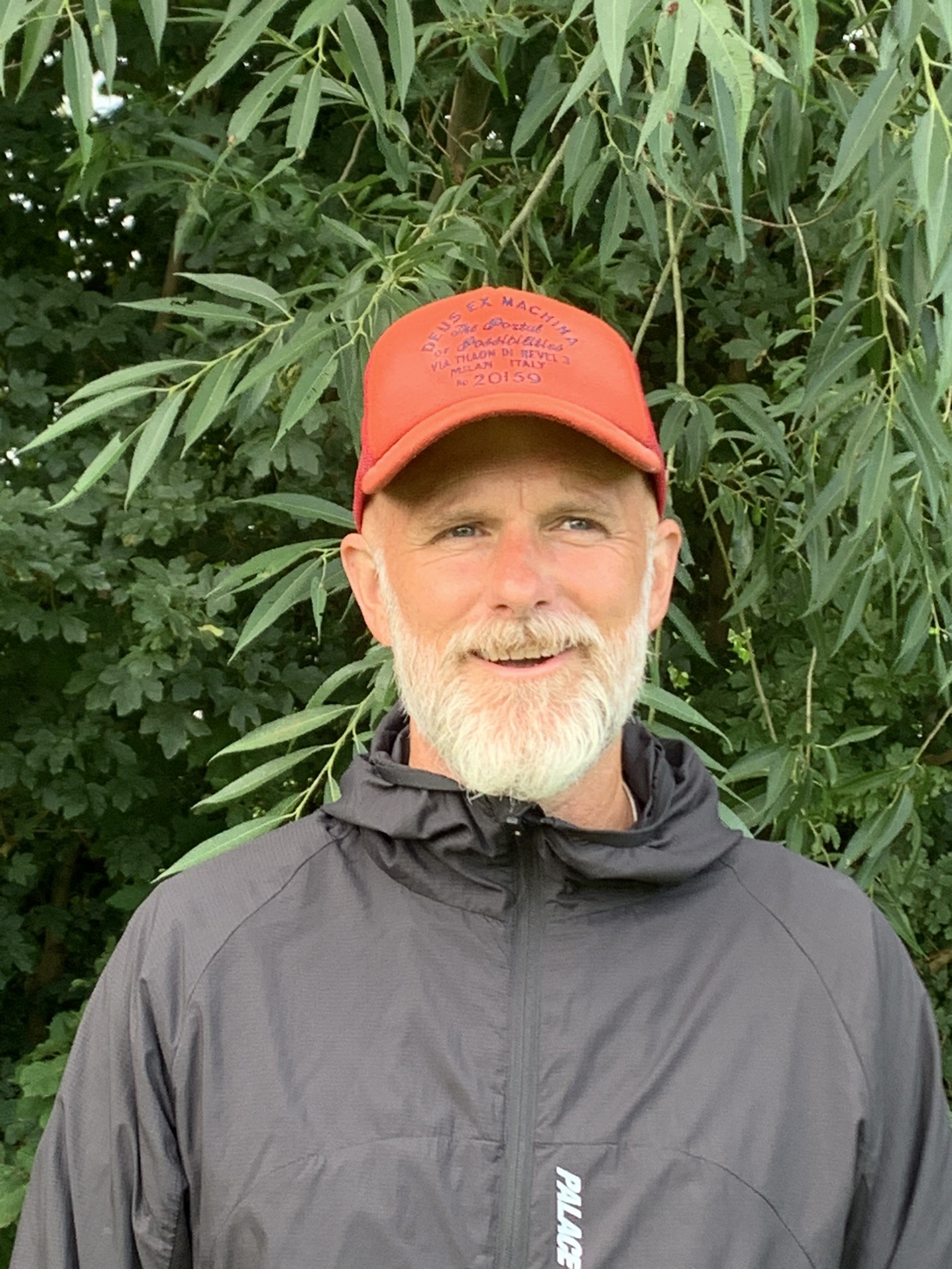 Matt McBride, plumber, in a red cap and dark jacket